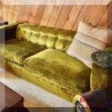 F123. Green velvet sofa.